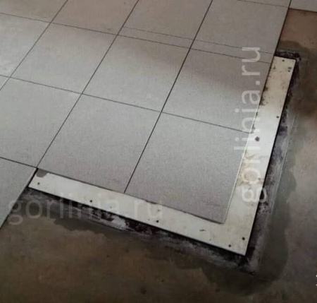 Облицовку плиткой крышки напольного люка